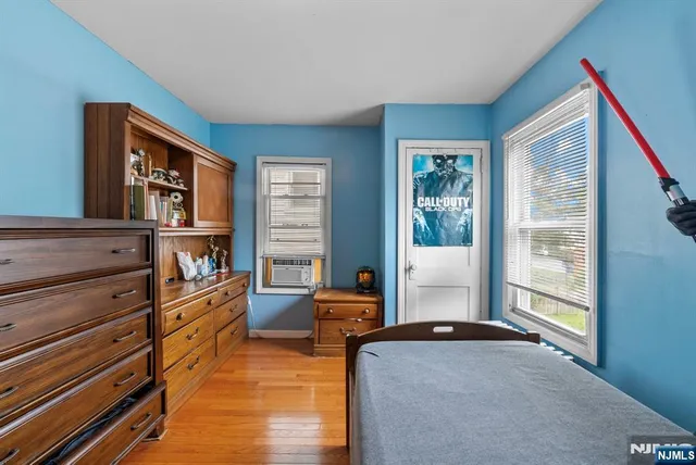 a bedroom with furniture and a window