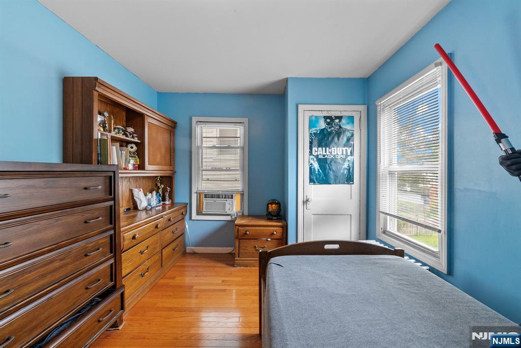 298 3rd Street Hackensack, NJ 07601 - Photo 24 of 36 a bedroom with furniture and a window