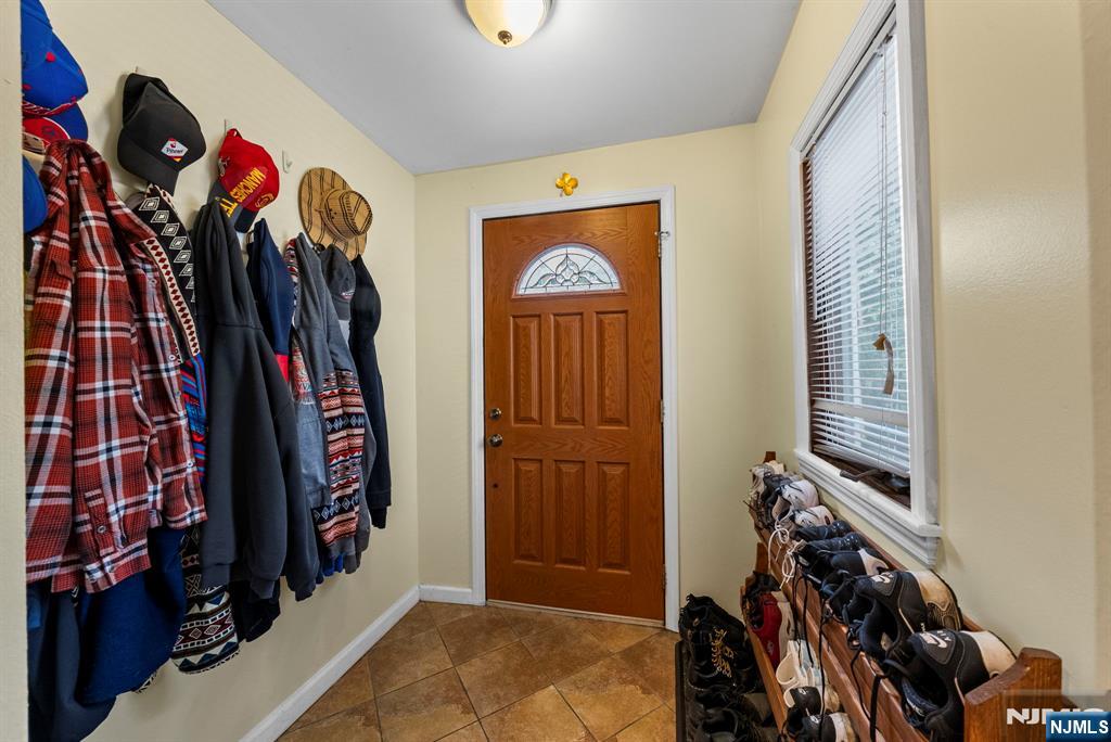 298 3rd Street Hackensack, NJ 07601 - Photo 31 of 36 a view of walk in closet with clothes and shoes