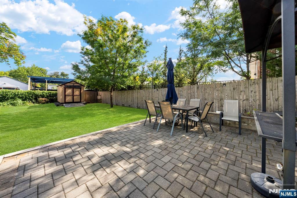 298 3rd Street Hackensack, NJ 07601 - Photo 32 of 36 a view of a house with backyard sitting area and garden