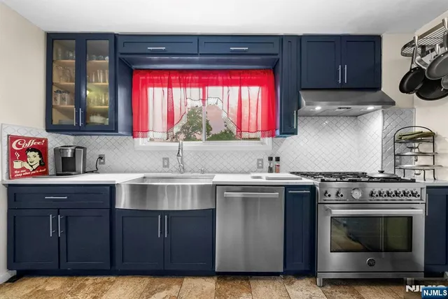 a kitchen with a stove and a sink