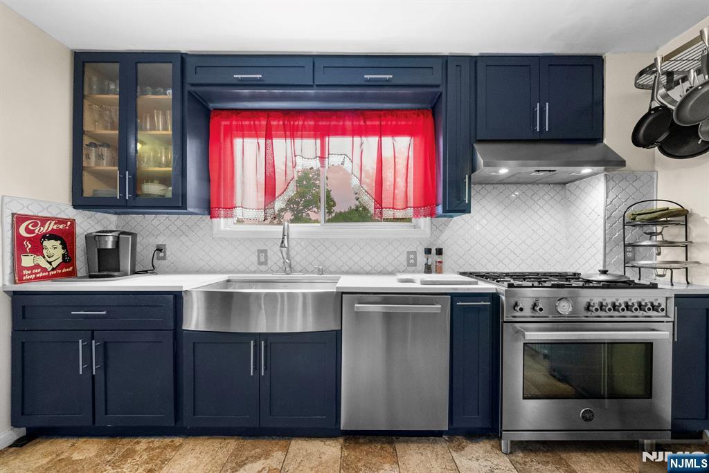 298 3rd Street Hackensack, NJ 07601 - Photo 4 of 36 a kitchen with a stove and a sink