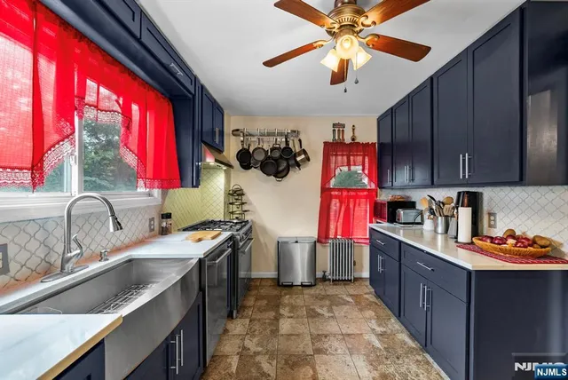 a kitchen that has a lot of cabinets in it