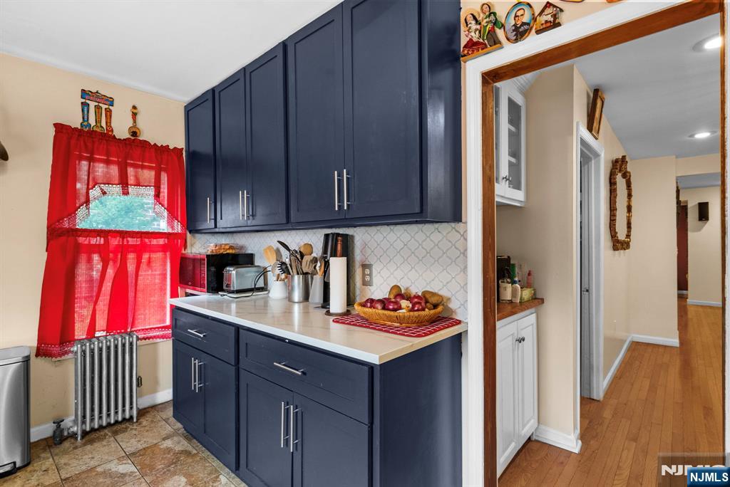 298 3rd Street Hackensack, NJ 07601 - Photo 10 of 36 a kitchen with stainless steel appliances granite countertop a refrigerator and a stove top oven