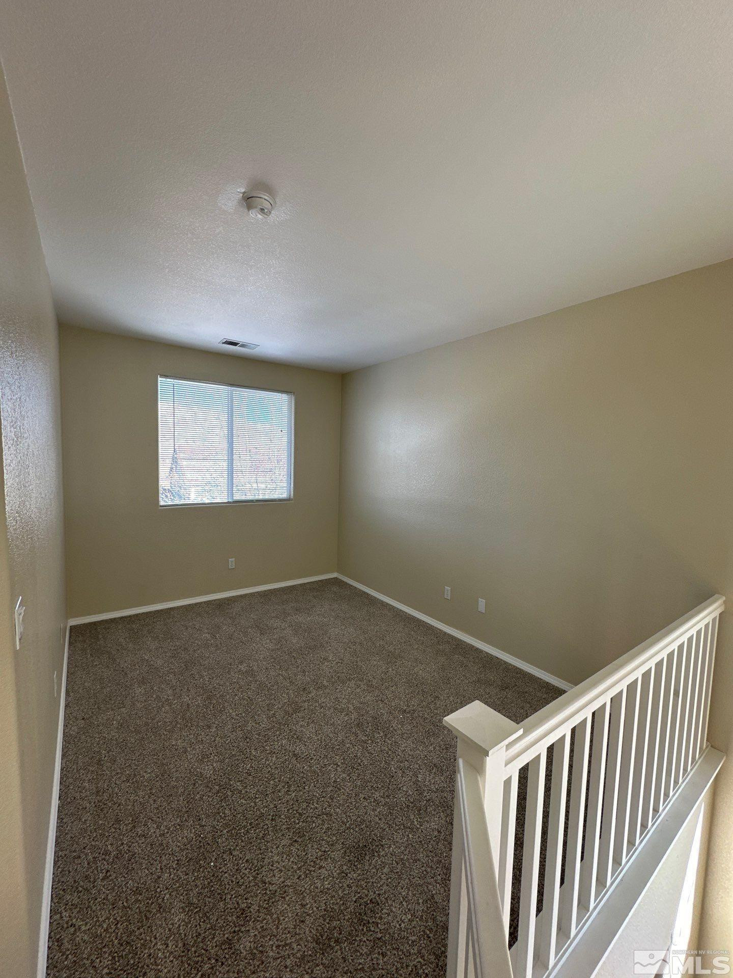 9648 Thunder Mountain Way Reno, NV 89521 - Photo 11 of 27 a view of an empty room and a window
