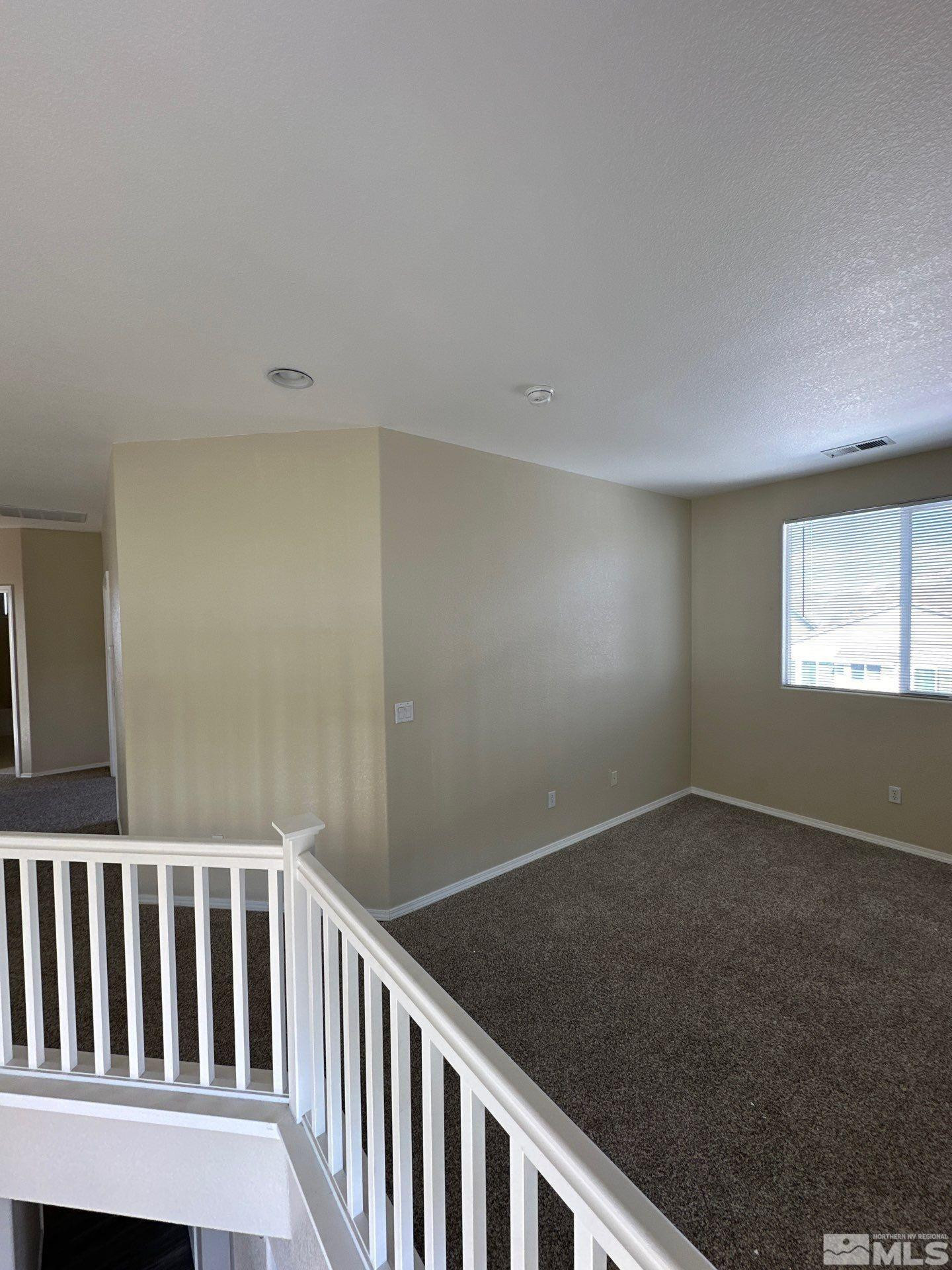 9648 Thunder Mountain Way Reno, NV 89521 - Photo 12 of 27 a view of an empty room with a window