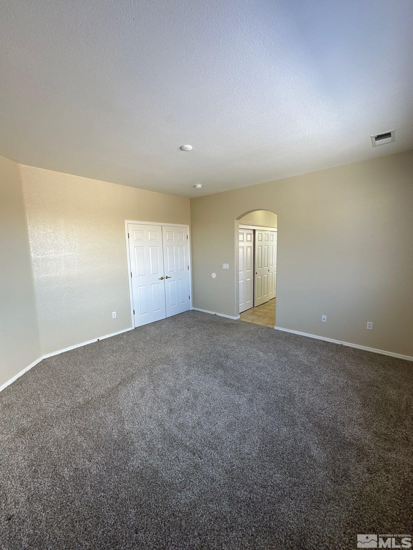 9648 Thunder Mountain Way Reno, NV 89521 - Photo 15 of 27 an empty room with an empty space and window