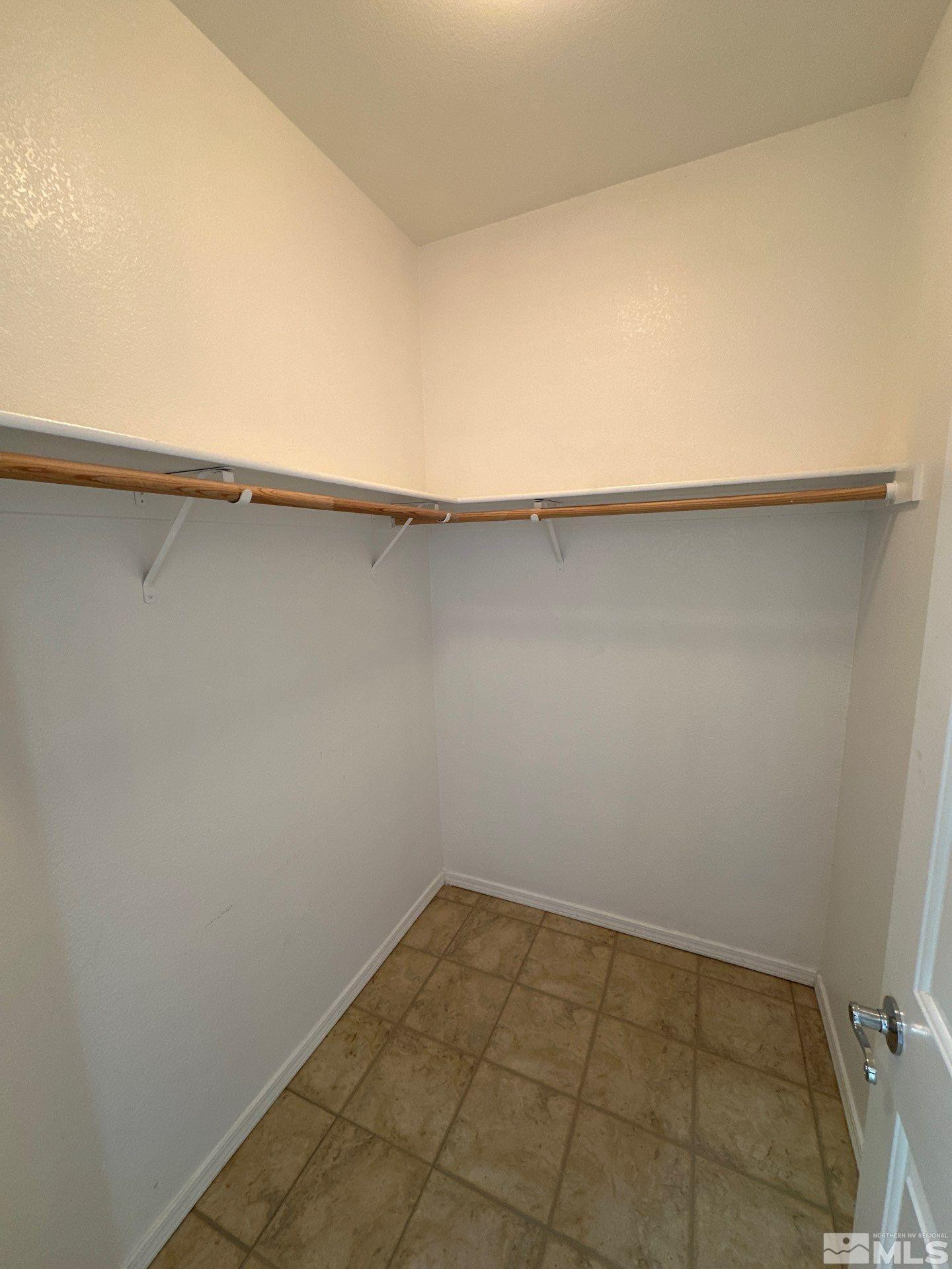 9648 Thunder Mountain Way Reno, NV 89521 - Photo 17 of 27 an empty room with a bench