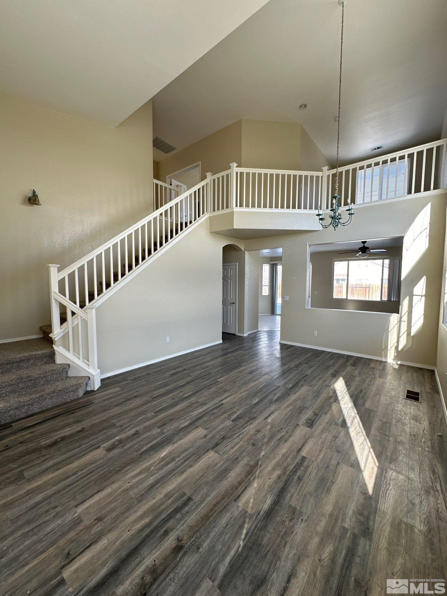9648 Thunder Mountain Way Reno, NV 89521 - Photo 3 of 27 a view of entryway and hall with wooden floor