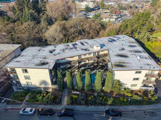 a view of a terrace with a wooden fence