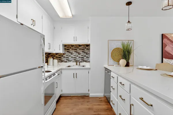 a view living room with a sink and wooden floor