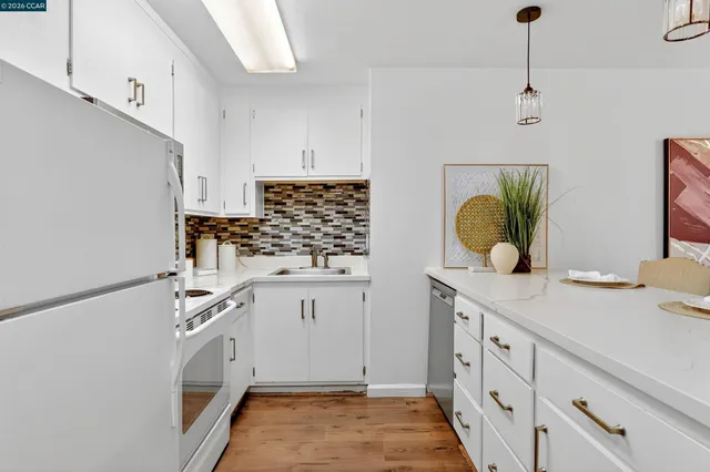 a view living room with a sink and wooden floor