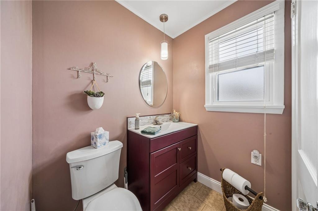 111 Orchard Avenue Rostraver Township, PA 15012 - Photo 13 of 42 a bathroom with a toilet a sink and mirror