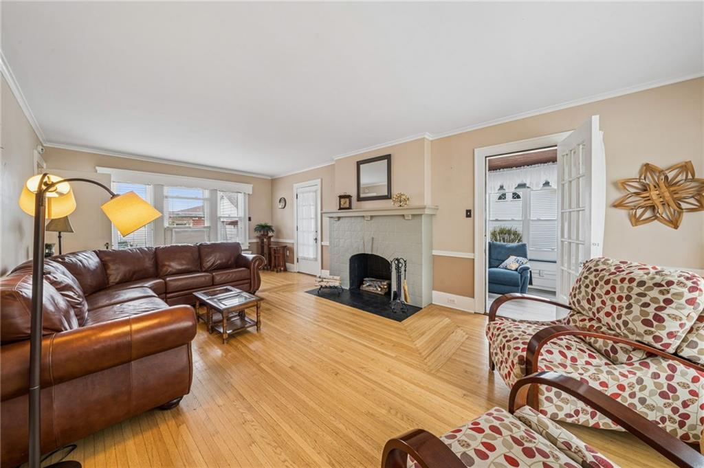 111 Orchard Avenue Rostraver Township, PA 15012 - Photo 16 of 42 a living room with furniture fireplace and a table