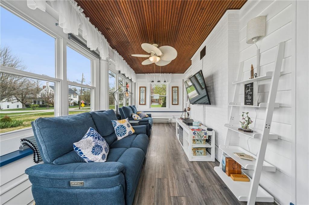 111 Orchard Avenue Rostraver Township, PA 15012 - Photo 17 of 42 a living room with furniture a fireplace and a large window