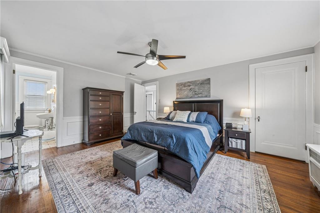 111 Orchard Avenue Rostraver Township, PA 15012 - Photo 20 of 42 a spacious bedroom with a bed a table and chair