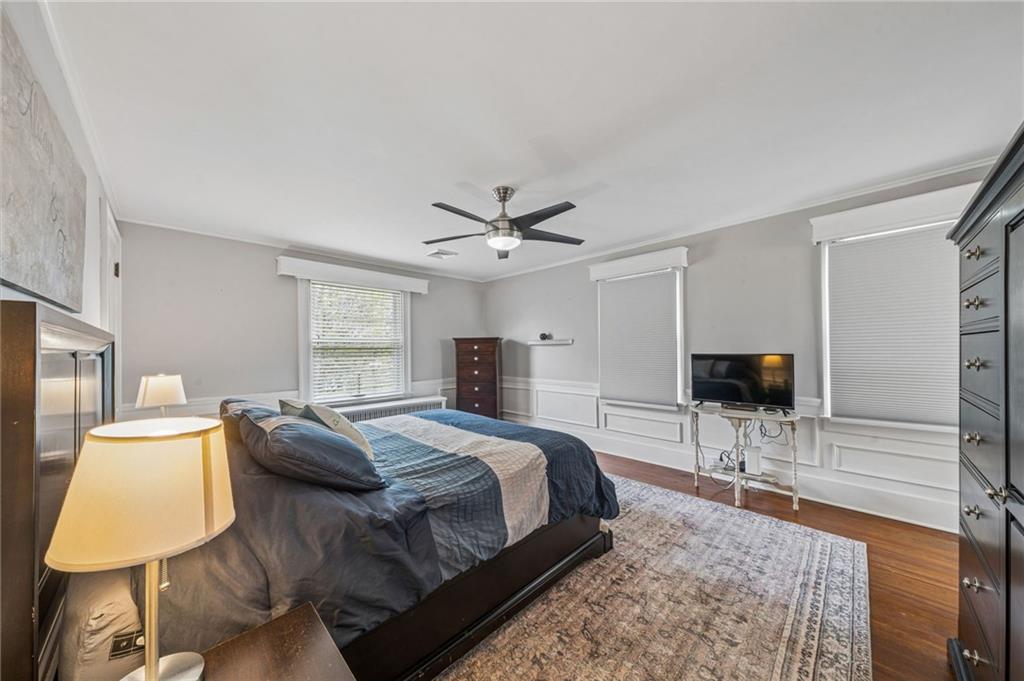 111 Orchard Avenue Rostraver Township, PA 15012 - Photo 21 of 42 a bedroom with a bed and a flat screen television