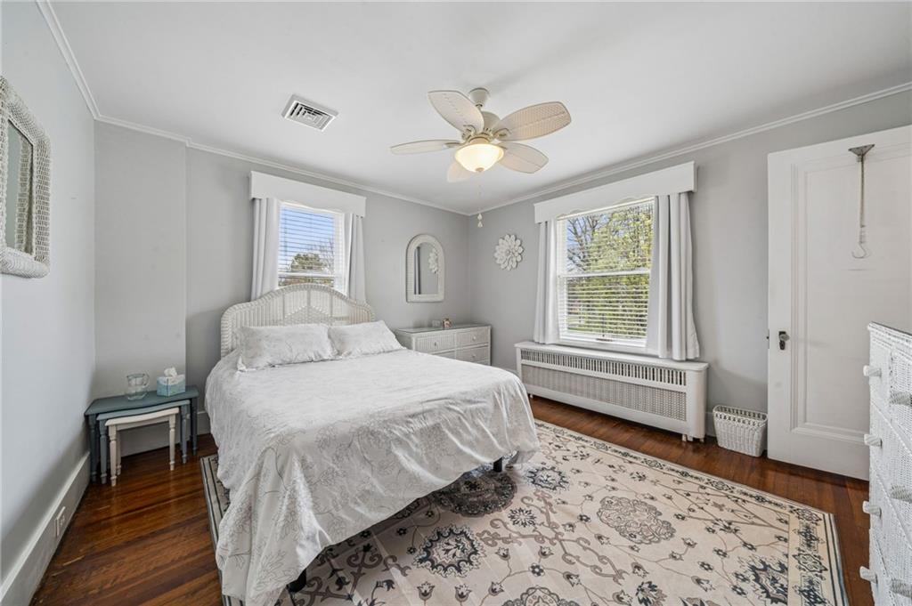 111 Orchard Avenue Rostraver Township, PA 15012 - Photo 23 of 42 a bedroom with a bed and a window with wooden floor
