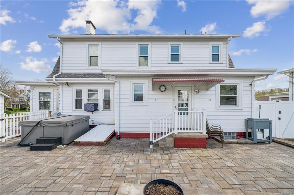 111 Orchard Avenue Rostraver Township, PA 15012 - Photo 29 of 42 a view of a white house with large windows and furniture