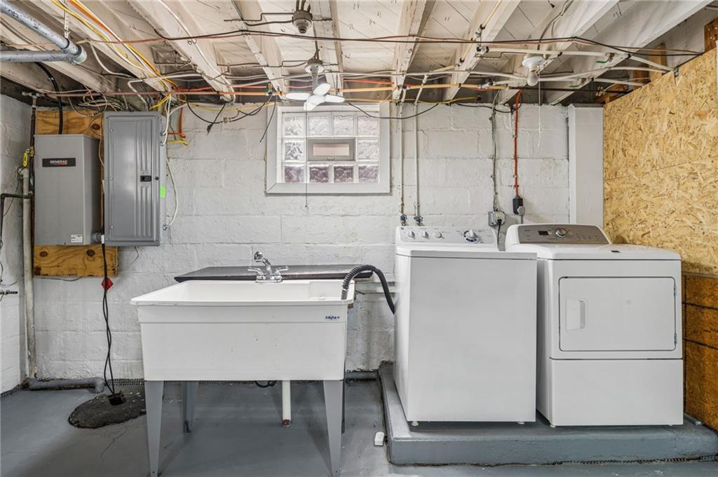 111 Orchard Avenue Rostraver Township, PA 15012 - Photo 35 of 42 a utility room with dryer and washer
