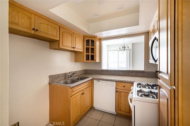 a kitchen with stainless steel appliances granite countertop a stove and a sink