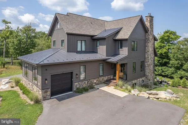 a front view of a house with yard