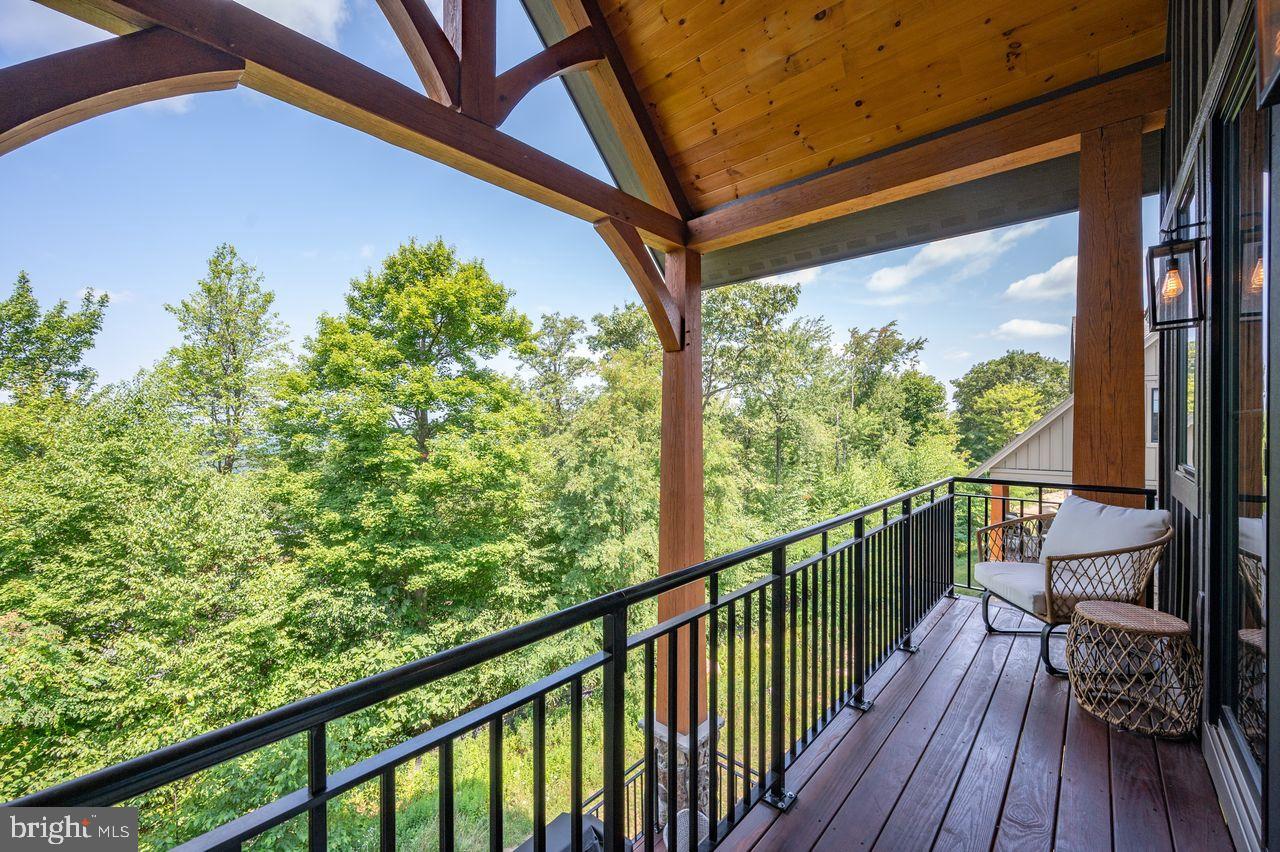 142 Ridge Run Road McHenry, MD 21541 - Photo 11 of 58 a view of balcony with wooden floor