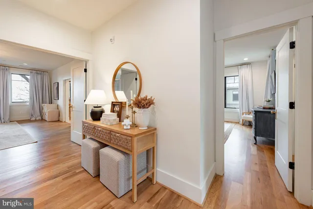 a view of living room with furniture and wooden floor