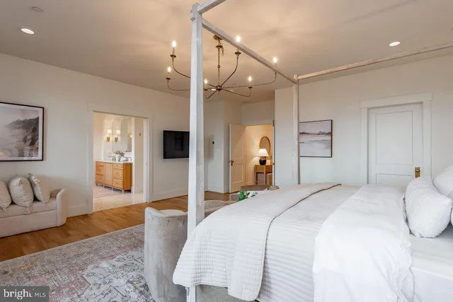 a spacious bedroom with a bed and a couch