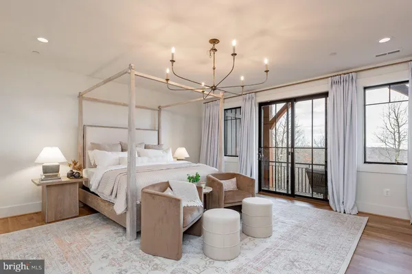 a bed room with a bed and a chandelier