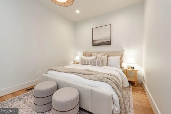 a bathroom with a toilet sink and a mirror