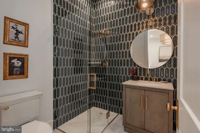 a bathroom with a toilet a sink and mirror