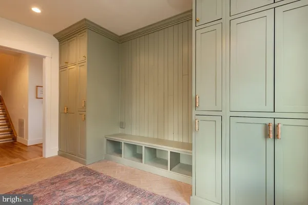 a view of a hallway with washer and dryer
