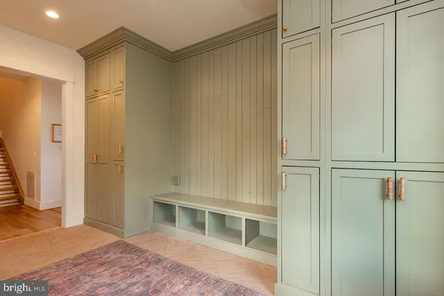 a view of a hallway with washer and dryer