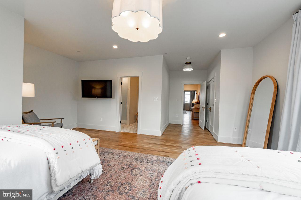 142 Ridge Run Road McHenry, MD 21541 - Photo 30 of 58 a bedroom with a bed and a flat screen tv