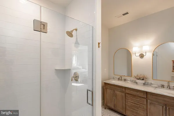 a bedroom with two beds and a flat screen tv