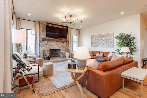 a living room with furniture fireplace and a flat screen tv