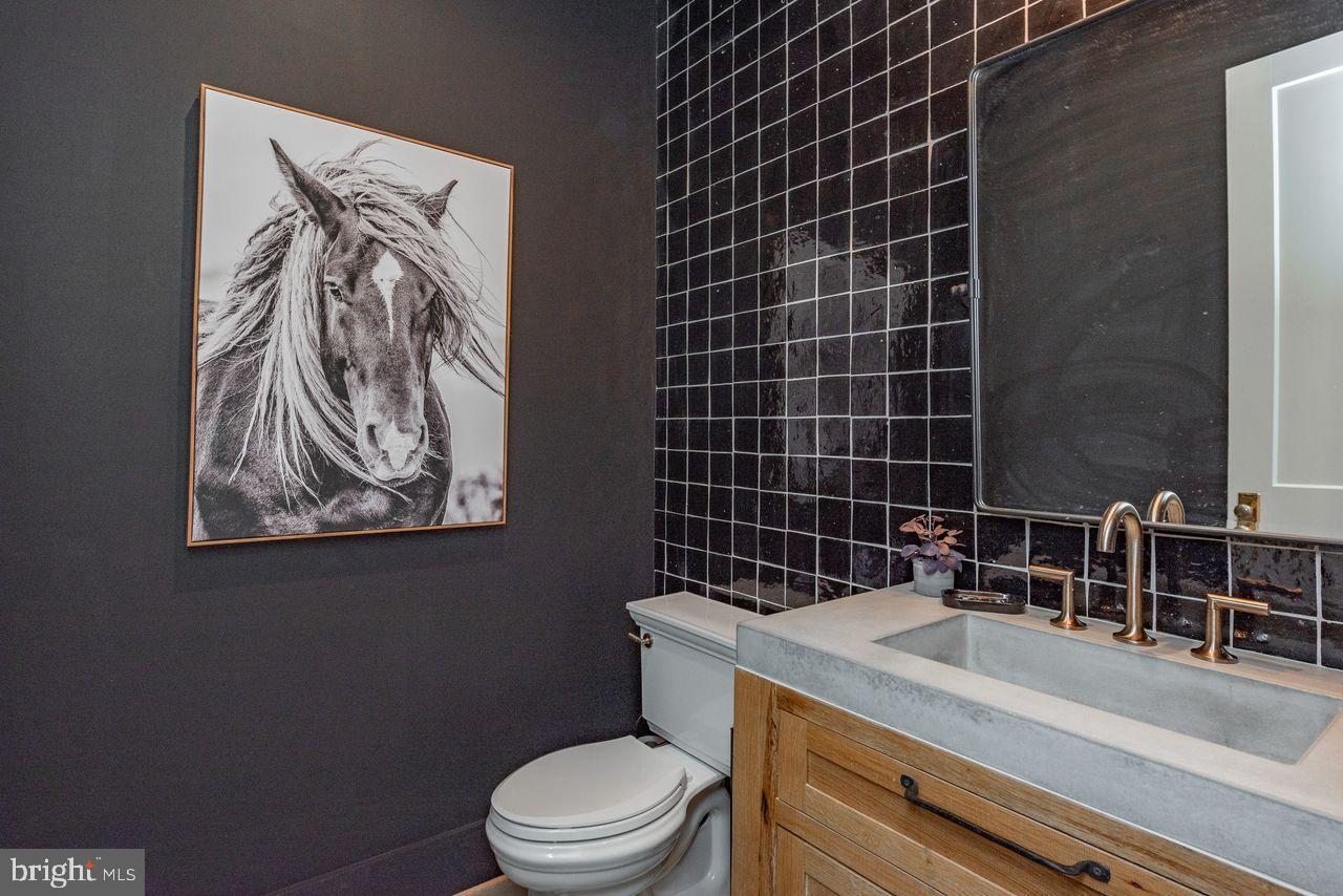 142 Ridge Run Road McHenry, MD 21541 - Photo 45 of 58 a bathroom with a toilet a sink and mirror