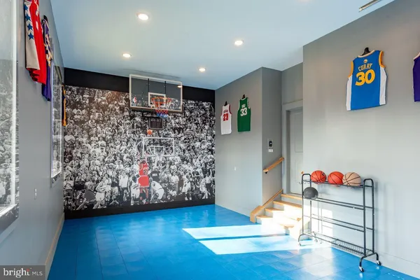 a view of a patio with table and chairs with wooden floor and fence