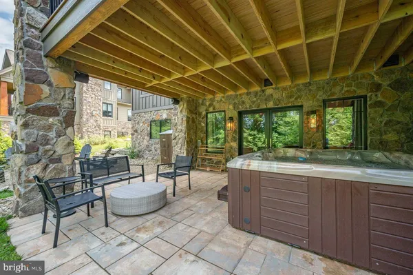 a backyard of a house with a table and chairs