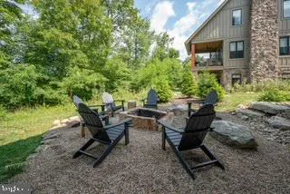 a view of a patio with table and chairs and potted plants