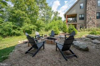 142 Ridge Run Road McHenry, MD 21541 - Photo 49 of 58 a backyard of a house with table and chairs