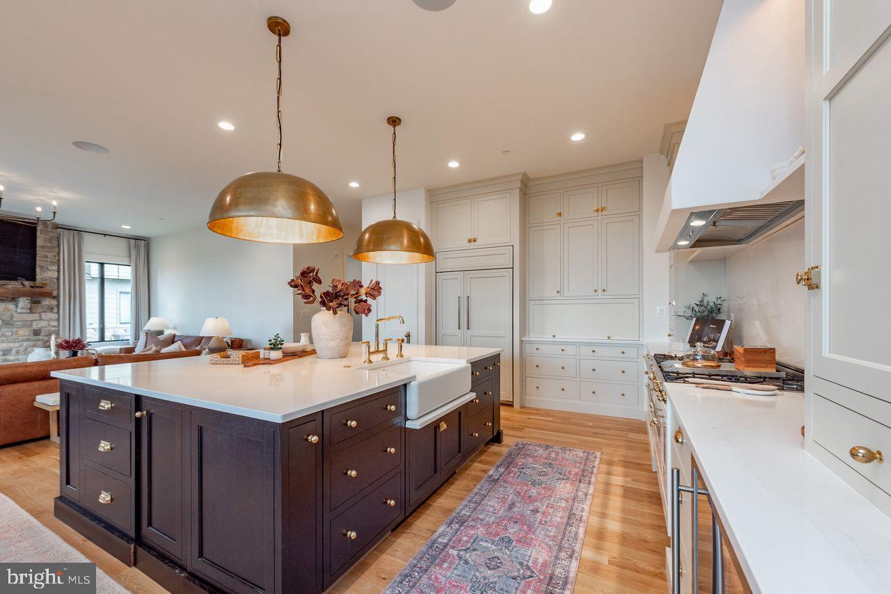 142 Ridge Run Road McHenry, MD 21541 - Photo 5 of 58 a large kitchen with kitchen island a stove a sink a center island and couches