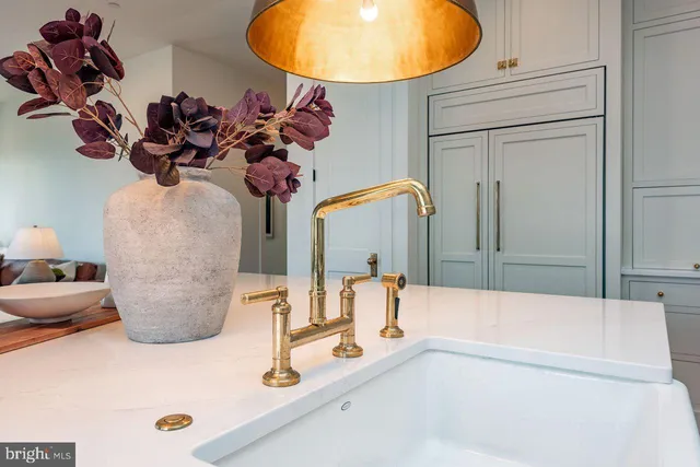 a bathroom with a tub sink and mirror