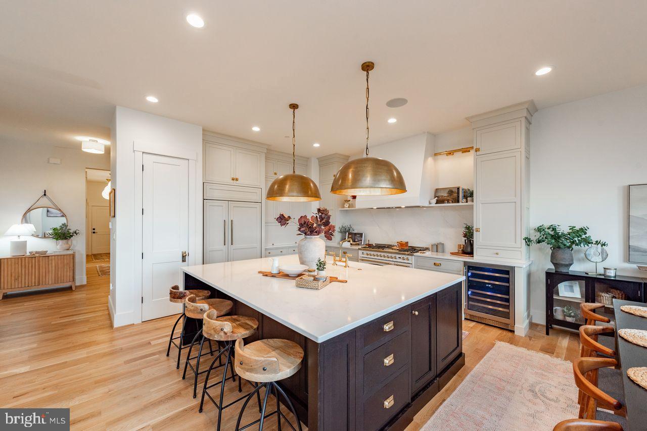 142 Ridge Run Road McHenry, MD 21541 - Photo 8 of 58 a kitchen with a sink a stove a refrigerator and chairs