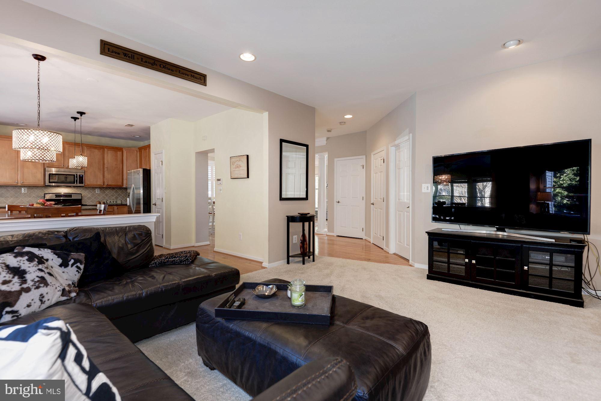 1326 Murray Downs Way Reston, VA 20194 - Photo 19 of 41 a living room with furniture and a flat screen tv