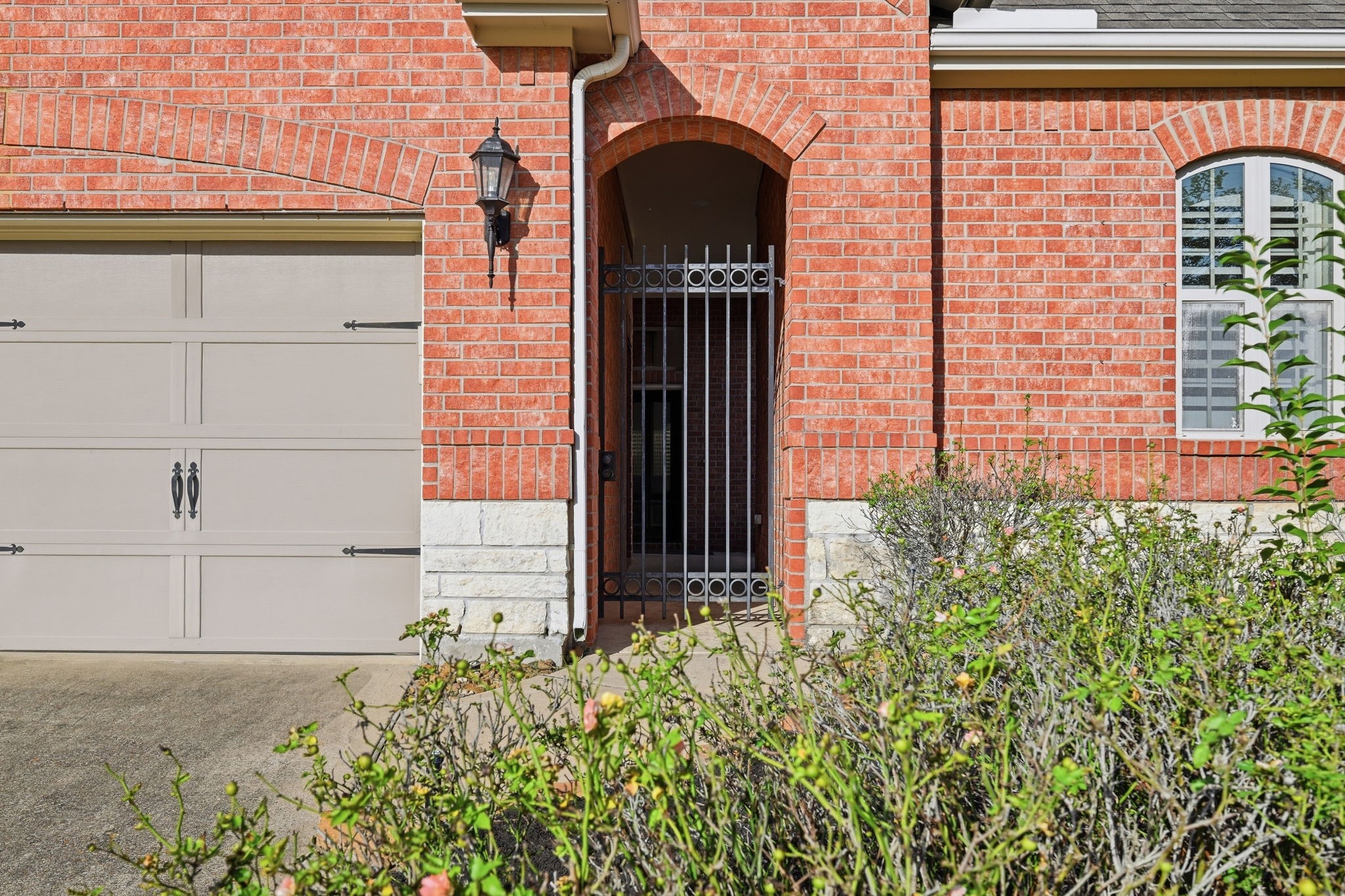 7 Sleeping Colt Place Spring, TX 77389 - Photo 29 of 32 Gated entry opens to the home’s private courtyard, adding both character and privacy.