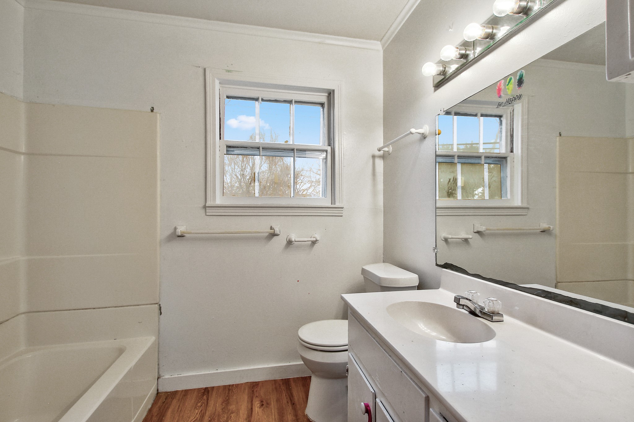 921 West 5th Street Taylor, TX 76574 - Photo 13 of 29 a bathroom with a sink toilet and shower
