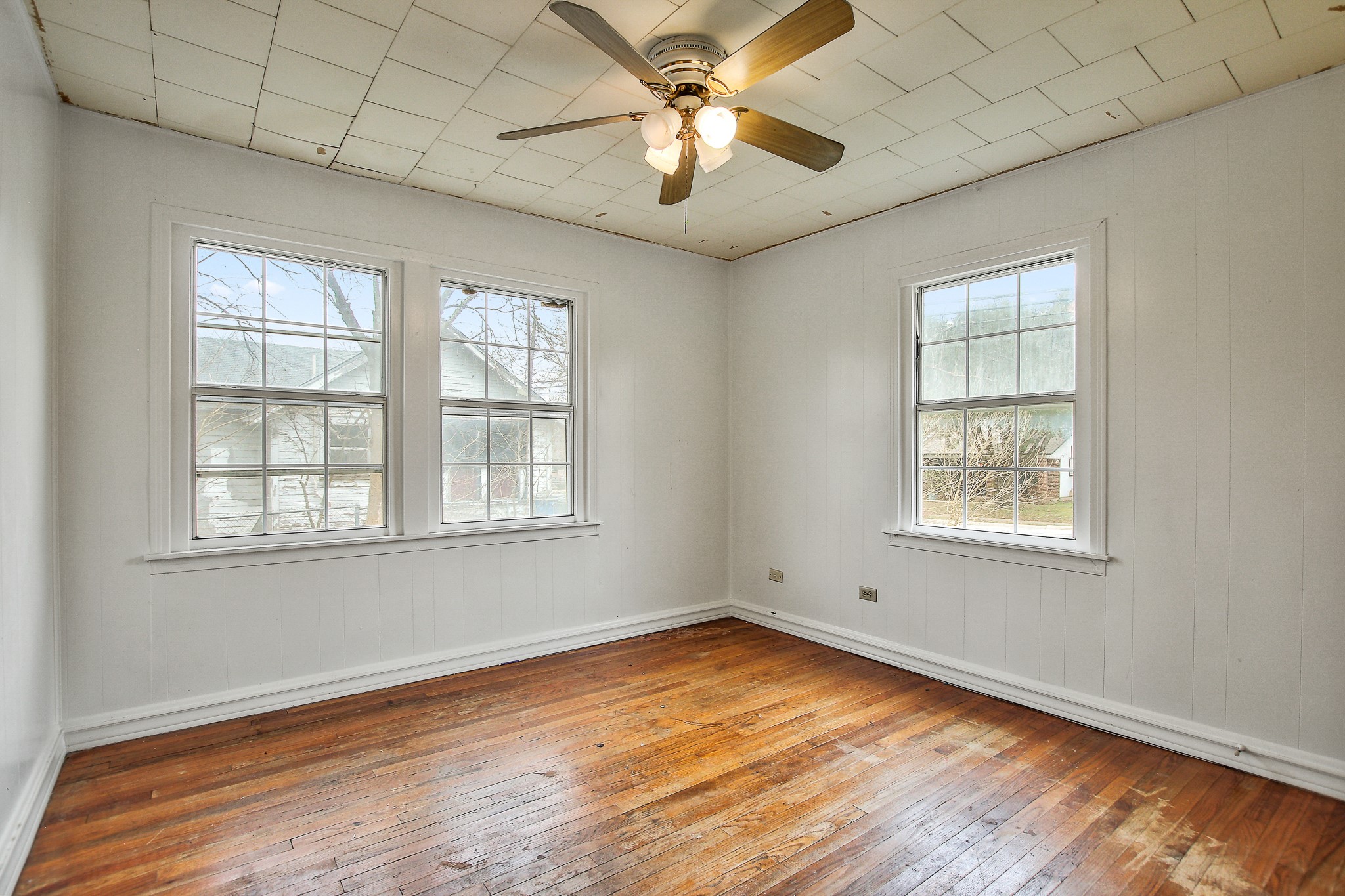 921 West 5th Street Taylor, TX 76574 - Photo 15 of 29 a view of an empty room with wooden floor and a window