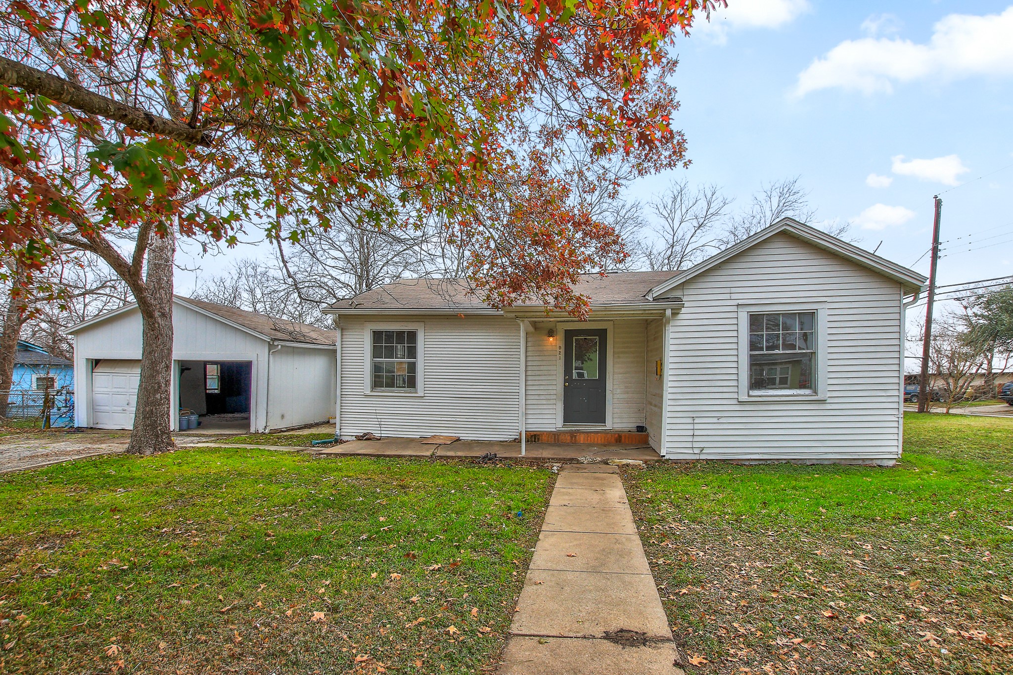 921 West 5th Street Taylor, TX 76574 - Photo 23 of 29 a front view of house with yard and green space